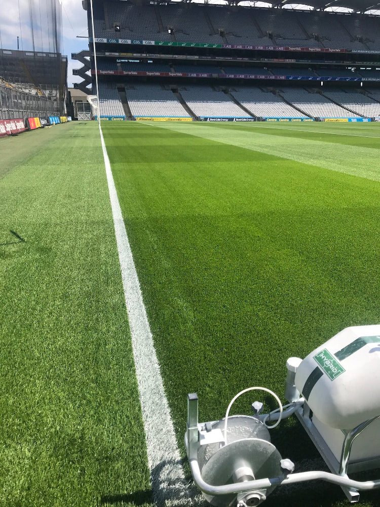 Soccer field with a line marker machine at a stadium